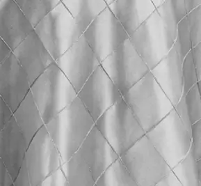 : Both styles feature a dimensional embossed petal texture but with different pattern shapes. The Leaf pattern has an organic flowing leaf shaped texture available in Ivory and Blush Pink. The Circle pattern has a rounder more symmetrical petal texture available in White, Ivory, and Blush Pink. Both create a soft three-dimensional surface that photographs beautifully and works well for romantic and garden inspired wedding table settings