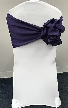 Satin flower on side chair sash rental for celebrations in Chicago suburbs