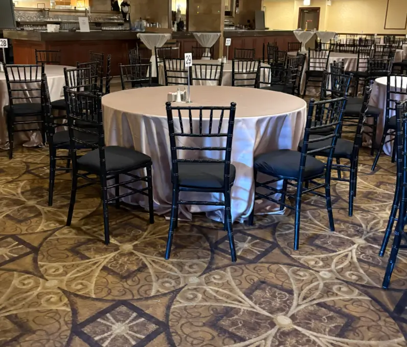 Black chiavari chair with champagne satin linen rental Chicago Chicagoland IL