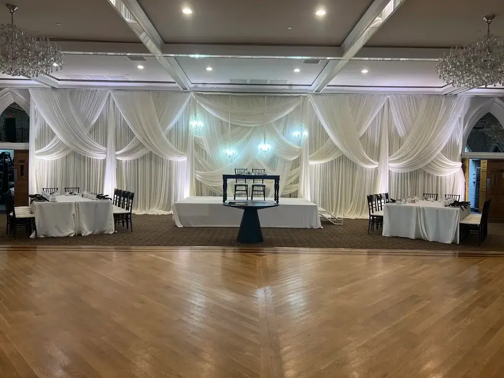 Wedding head table setup with backdrop and linen rentals in Orland Park IL