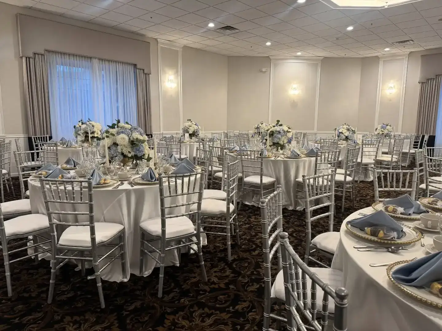 Silver chiavari chair and satin linen rental in Chicagoland Illinois