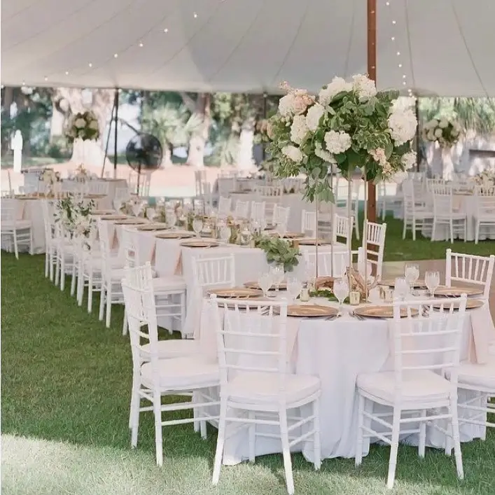 Gold metallic chairs with elegant round tables at a wedding reception — party rental delivery in Tinley Park, IL by M&M Event Planners